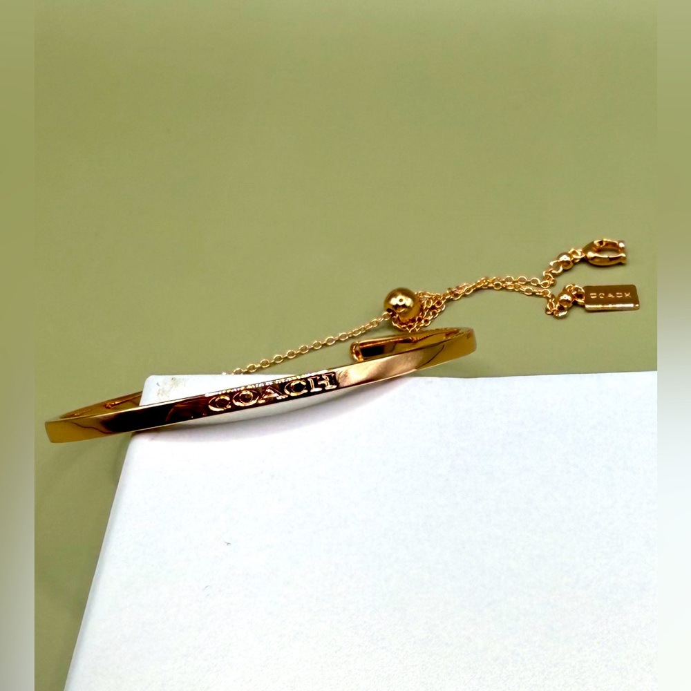 Coach Gold Bangle Toggle Bracelet in Rose Gold.
